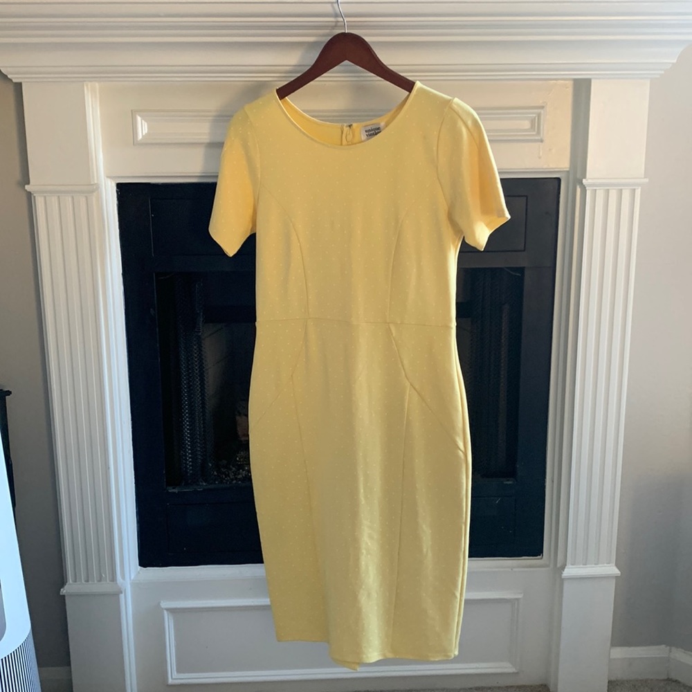 Light yellow bodycon midi with small slit on bottom